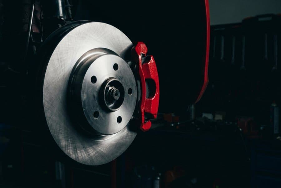 Illustrative example: Corroded brake rotor beside a newly installed rotor, after